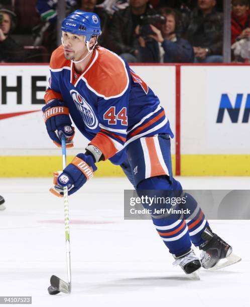 Sheldon Souray of the Edmonton Oilers skates up ice with the puck during their game against the Vancouver Canucks at General Motors Place on November...