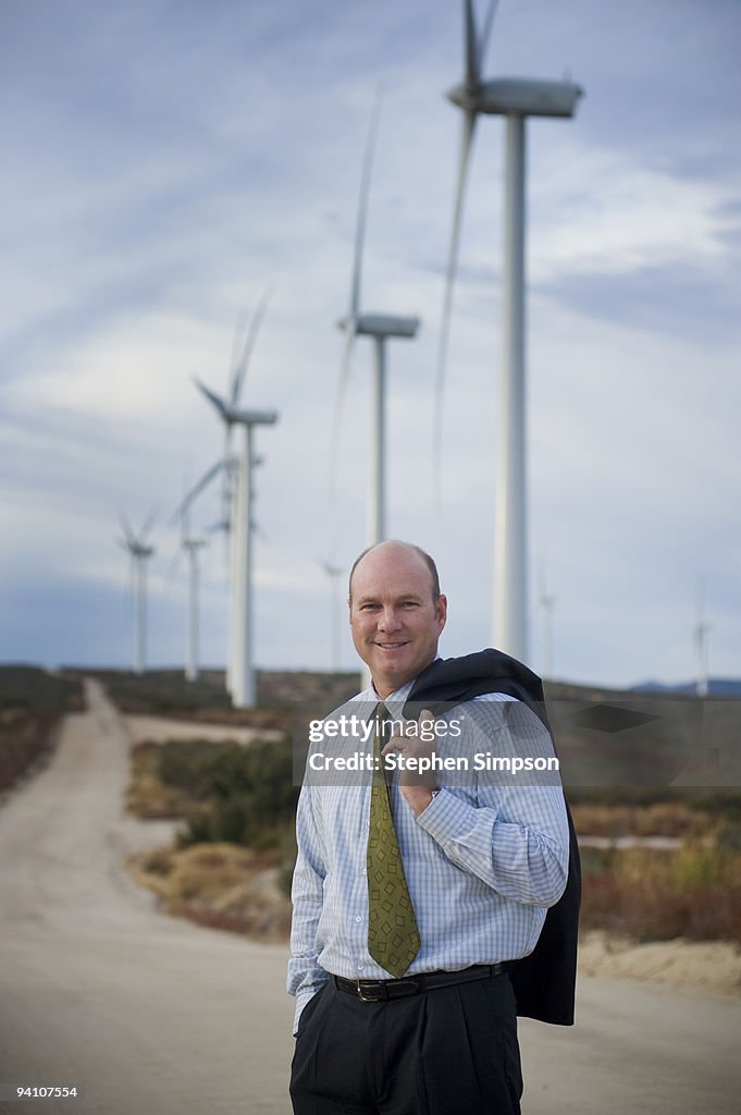 Businessman at wind farm