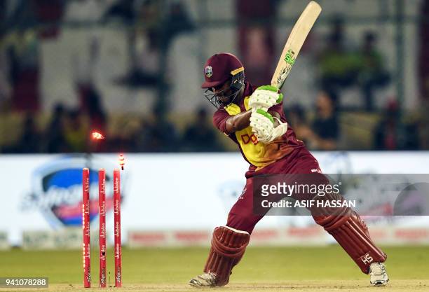 West Indies' captain Jason Mohammed is bowled out by Pakistans' bowler Mohammad Amir during the second Twenty20 International cricket match between...