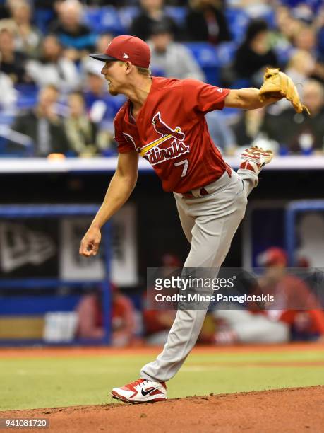 Luke Weaver of the St. Louis Cardinals throws a pitch against the Toronto Blue Jays during the MLB preseason game at Olympic Stadium on March 27,...