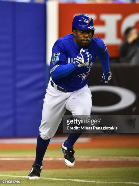 Gift Ngoepe of the Toronto Blue Jays runs a towards first base against the St. Louis Cardinals during the MLB preseason game at Olympic Stadium on...