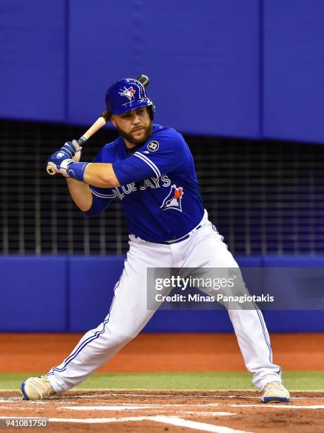 Russell Martin of the Toronto Blue Jays prepares to swinging against the St. Louis Cardinals during the MLB preseason game at Olympic Stadium on...