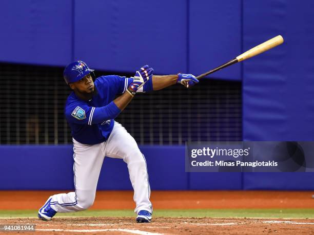 Teoscar Hernandez of the Toronto Blue Jays bats against the St. Louis Cardinals during the MLB preseason game at Olympic Stadium on March 27, 2018 in...