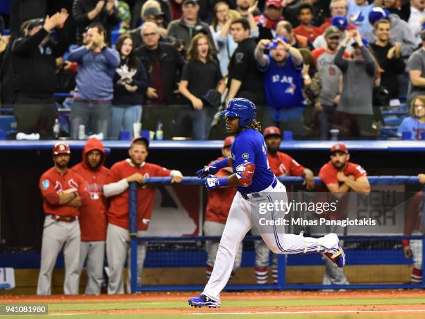 Vladimir Guerrero Jr. #27 of the Toronto Blue Jays runs the bases as he hits a walk-off home run against the St. Louis Cardinals during the MLB...