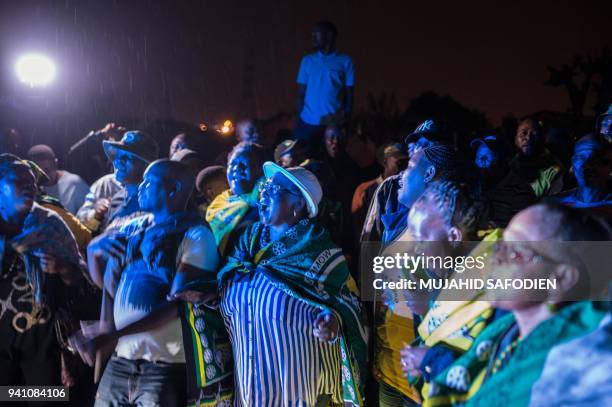 Residents and friends gather outside the home of the late South African anti-apartheid campaigner Winnie Madikizela-Mandela, ex-wife of former South...