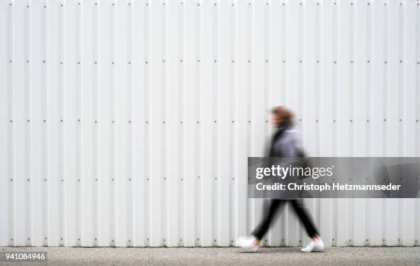 walking woman street - street wall stock pictures, royalty-free photos & images