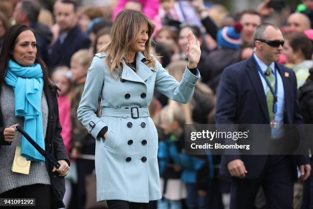 First Lady Melania Trump waves during the Easter Egg Roll on the South Lawn of the White House in Washington, Washington, D.C., U.S., on Monday,...