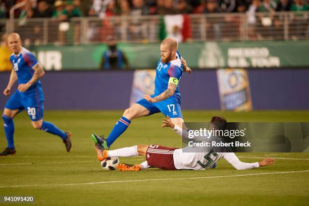 Iceland Aron Gunnarsson in action vs Mexico Diego Reyes during International Friendly at Levi's Stadium. San Francisco, CA 3/26/2018 CREDIT: Robert...