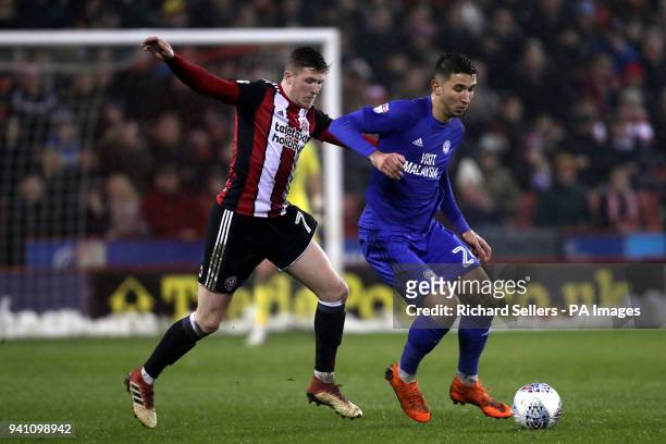 Sheffield United's John Lundstram and Cardiff City's Marko Grujic battle for the ball during the Championship match at Bramall Lane, Sheffield.