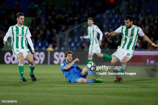 Fabian Ruiz Pena of Real Betis, Mathieu Flamini of Getafe, Jordi Amat of Real Betis during the La Liga Santander match between Getafe v Real Betis at...