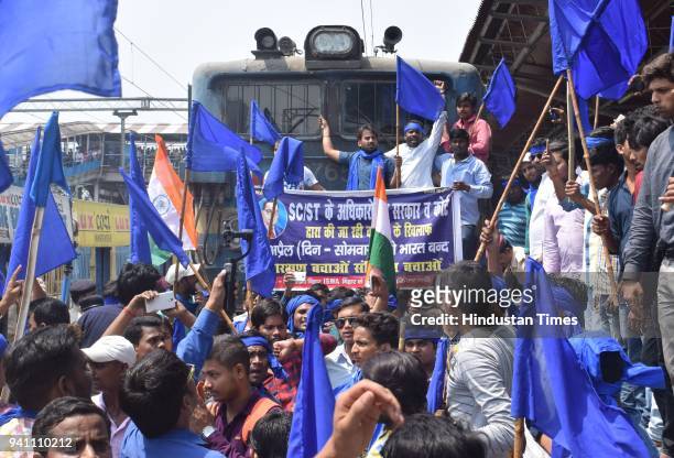 Dalit people and Bhim Party stopped train on railway track at Patna Junction during Bharat Bandh called by Dalit organizations against the alleged...
