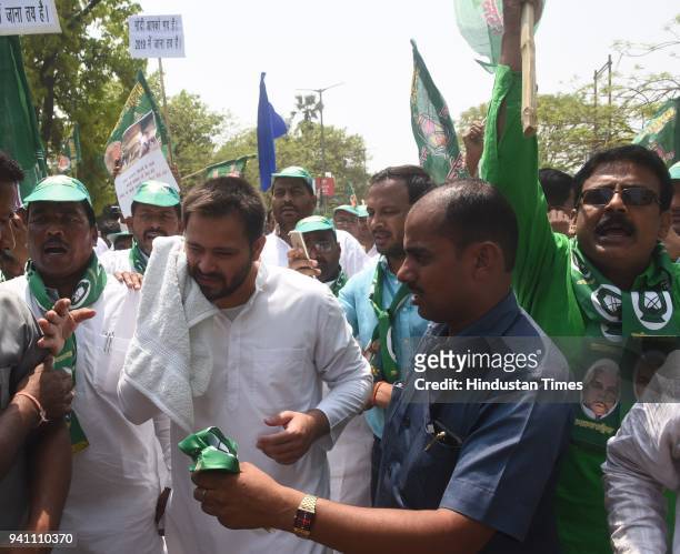Leader of Opposition RJD Tejashwi Prasad Yadav takes out a rally at Dak Bungalow crossing in Patna during Bharat Bandh call by Dalit organizations...