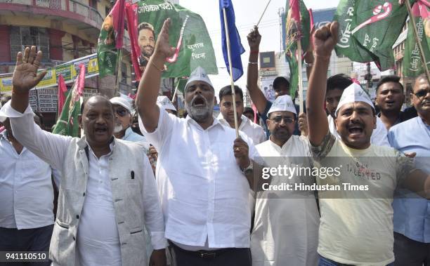 Jan Adhikar Party president Pappu Yadav demonstrates with his party workers at Dak Bungalow crossing in Patna during Bharat Bandh call by Dalit...