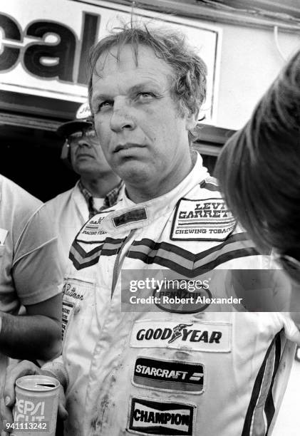 Driver Joe Ruttman talks with reporters after competing in the 1983 Daytona 500 stock car race at Daytona International Speedway in Daytona Beach,...