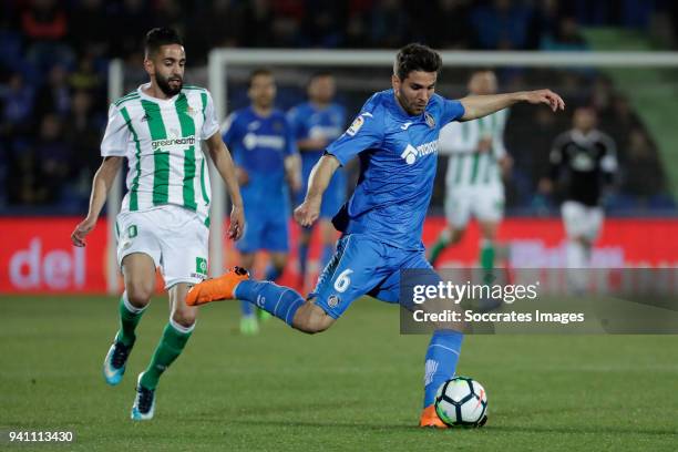 Ryad Boudebouz of Real Betis, Leandro Cabrera of Getafe during the La Liga Santander match between Getafe v Real Betis at the Coliseum Alfonso Perez...