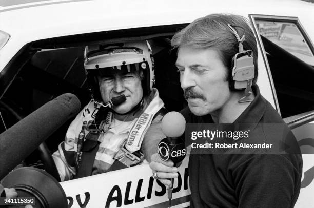 An CBS television reporter interviews NASCAR driver Bobby Allison prior to the start of the 1983 Daytona 500 stock car race at Daytona International...