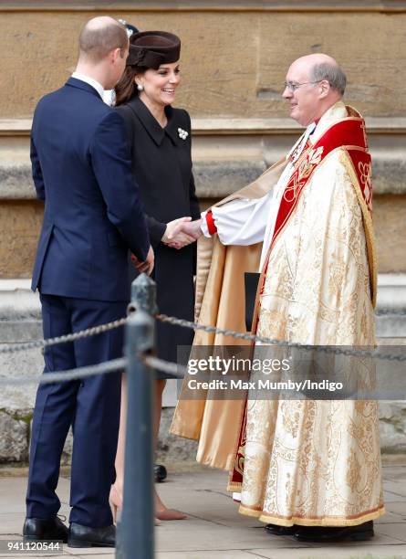 Prince William, Duke of Cambridge and Catherine, Duchess of Cambridge are greeted by the Dean of Windsor The Right Reverend David Conner as they...