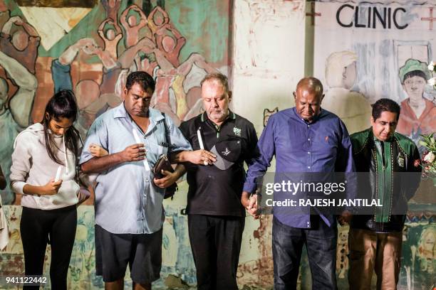 South Africans gather at the Old Durban Prison's Human Rights wall to pay their respects to the late South African high-profile anti-apartheid...