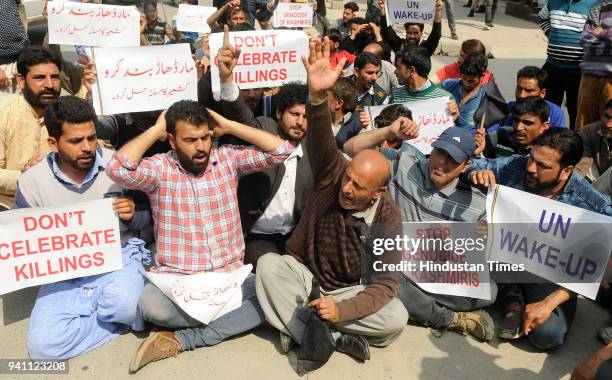 Kashmir lawmaker, Engineer Abdul Rashid Sheikh along with his supporters shout slogans during a protest against the bloodshed in Kashmir on April 2,...