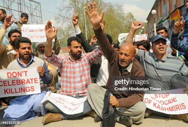 Kashmir lawmaker, Engineer Abdul Rashid Sheikh along with his supporters shout slogans during a protest against the bloodshed in Kashmir on April 2,...