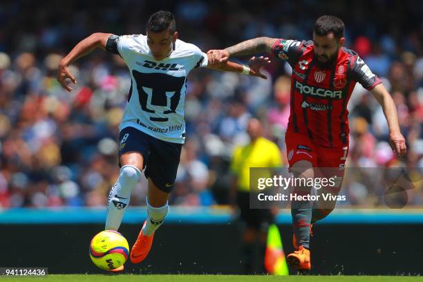 Pablo Barrera of Pumas struggles for the ball with Luis Gallegos of Necaxa during the 13th round match between Pumas UNAM and Necaxa as part of the...