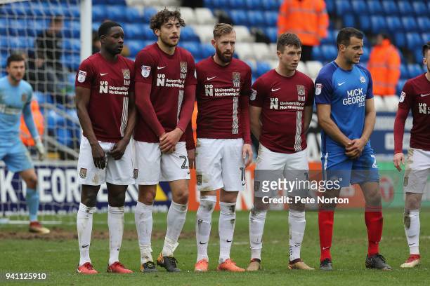 Leon Barnett, Matt Crooks, Kevin van Veen, Chris Long of Northampton Town line up to defend a free kick with Steven Taylor of Peterborough United...