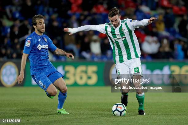 Mathieu Flamini of Getafe, Fabian Ruiz Pena of Real Betis during the La Liga Santander match between Getafe v Real Betis at the Coliseum Alfonso...