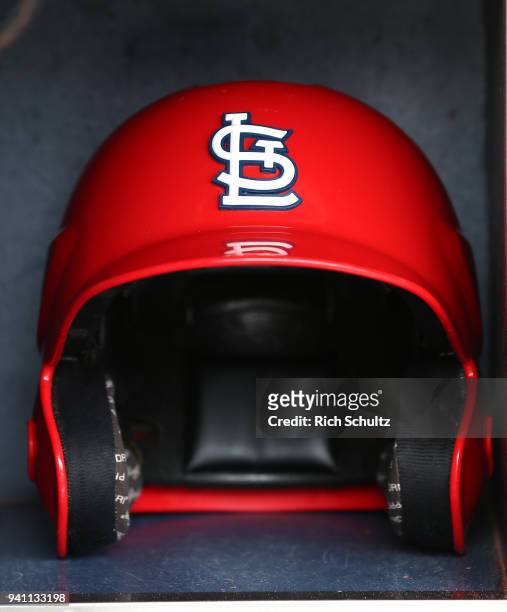 St. Louis Cardinals batting helmet in the dugout before a game against the New York Mets at Citi Field on March 29, 2018 in the Flushing neighborhood...