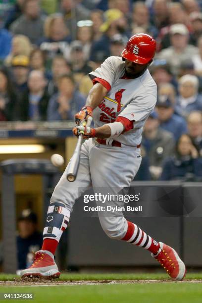 Dexter Fowler of the St. Louis Cardinals hits a single in the third inning against the Milwaukee Brewers at Miller Park on April 2, 2018 in...