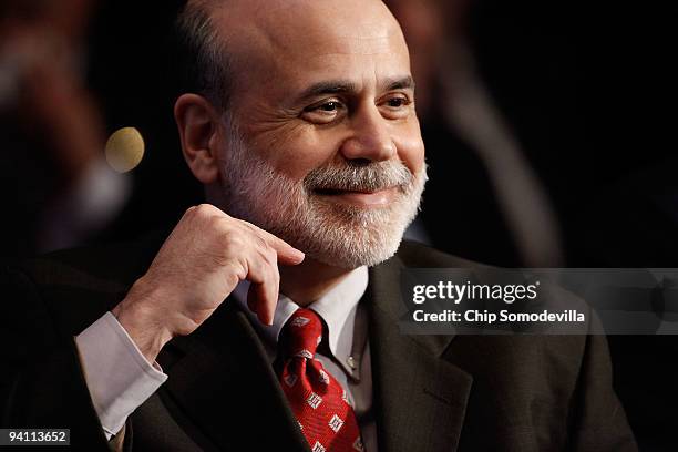 Federal Reserve Bank Chairman Ben Bernanke listens to his introduction before addressing the Economic Club of Washington during the organization's...