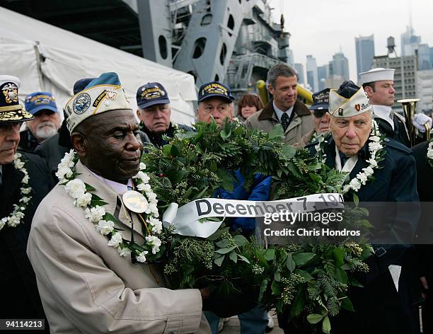 Clarke Simmons and Aaron Chabin, both of New York and both veterans who were servining in Pearl Harbor when it was attacked on December 7 carry a...