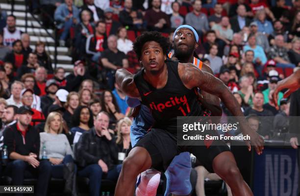 Ed Davis of the Portland Trail Blazers boxes out Montrezl Harrell of the LA Clippers during the game on March 30, 2018 at the Moda Center Arena in...