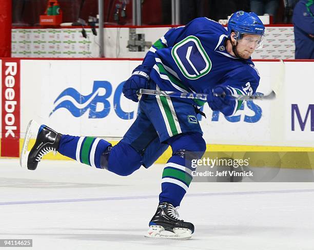 Alexander Edler of the Vancouver Canucks takes a slapshot during their game against the San Jose Sharks at General Motors Place on November 29, 2009...