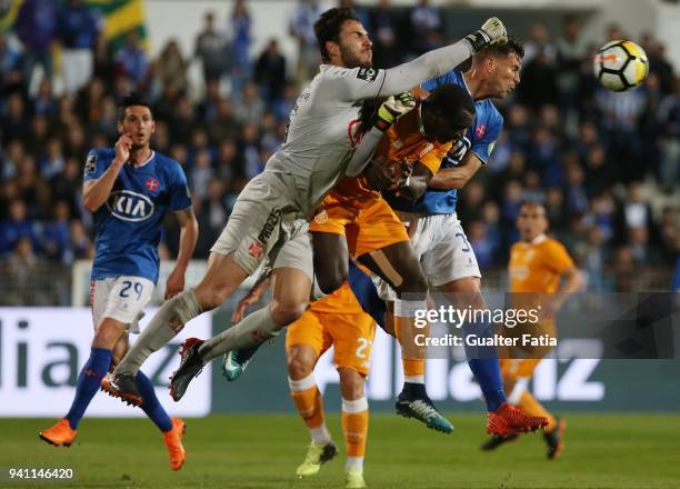 Os Belenenses goalkeeper Andre Moreira from Portugal with FC Porto forward Vincent Aboubakar from Cameroon and CF Os Belenenses midfielder Robert...