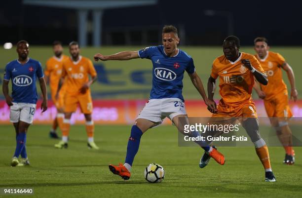 Os Belenenses midfielder Hassan Yebda from Algeria with FC Porto forward Vincent Aboubakar from Cameroon in action during the Primeira Liga match...
