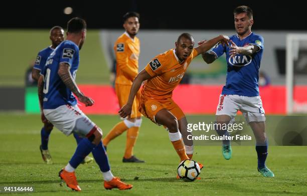 Porto forward Yacine Brahimi from Algeria with CF Os Belenenses forward Nathan from Brazil in action during the Primeira Liga match between CF Os...