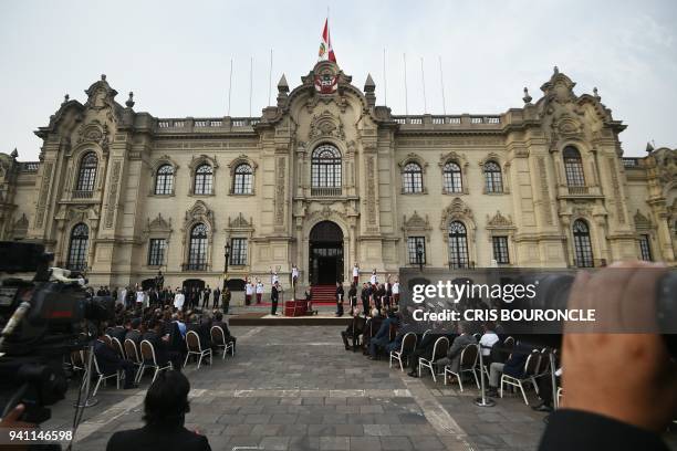 General view of Peruvian President Martin Vizcarra swearing in his eighteen new ministers during a ceremony at the main courtyard of the Palace of...