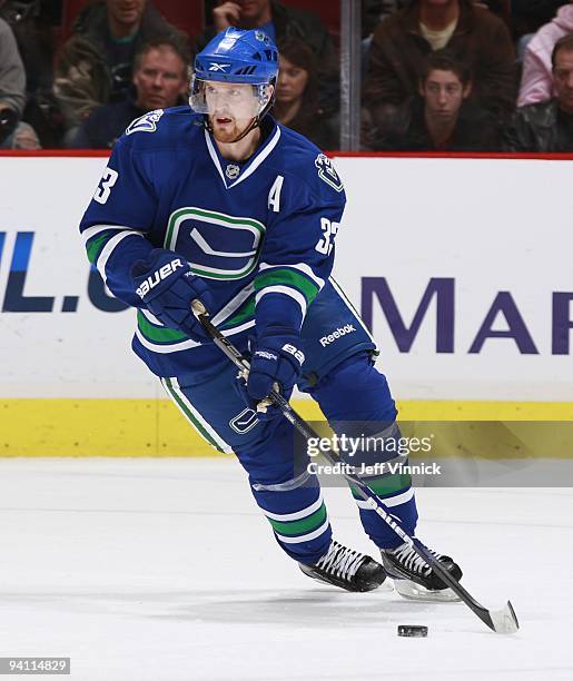 Henrik Sedin of the Vancouver Canucks skates up ice with the puck during their game against the San Jose Sharks at General Motors Place on November...