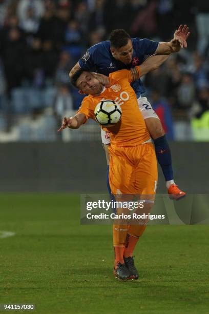 Porto midfielder Hector Herrera from Mexico vies with CF Os Belenenses midfielder Hassan Yebda from Algeria for the ball possession during the...