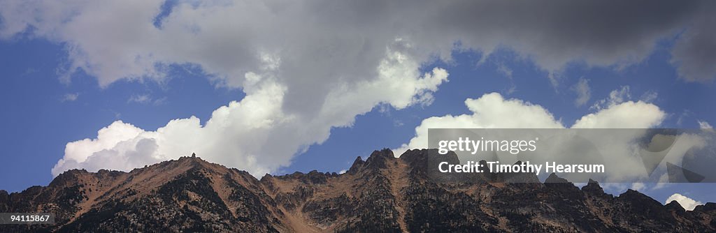Jagged mountain peaks with clouds