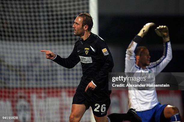 Patrick Milchraum of Aachen celebrates scoring the first team goal whilst Fuerth's keeper Stephan Loboue reacts during the Second Bundesliga match...