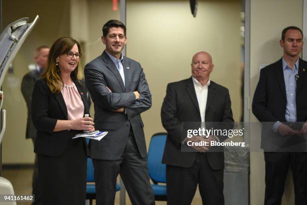 House Speaker Paul Ryan, a Republican from Wisconsin, center left, and Representative Kevin Brady, a Republican from Texas, center right, visit a...