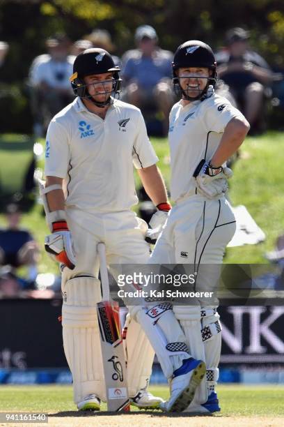 Tom Latham and Henry Nicholls of New Zealand look on during day five of the Second Test match between New Zealand and England at Hagley Oval on April...