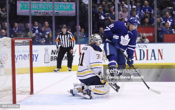 Toronto Maple Leafs left wing Andreas Johnsson jumps in front of Buffalo Sabres goaltender Chad Johnson as the Toronto Maple Leafs play the Buffalo...