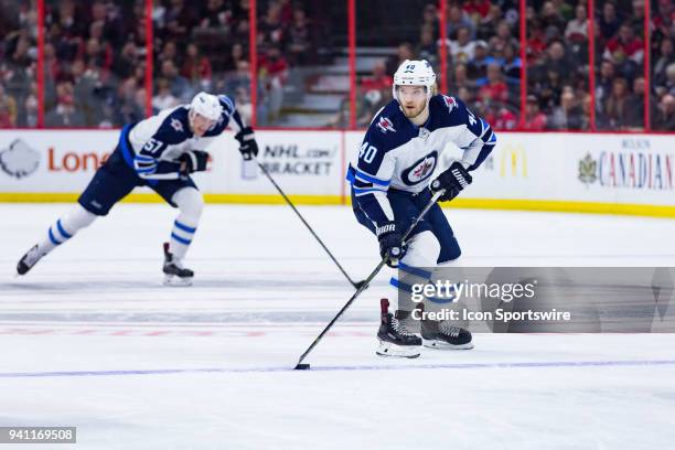 Winnipeg Jets Right Wing Joel Armia skates the puck into the zone during first period National Hockey League action between the Winnipeg Jets and...