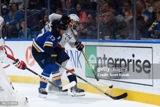 Jaden Schwartz of the St. Louis Blues checks Michal Kempny of the Washington Capitals at Scottrade Center on April 2, 2018 in St. Louis, Missouri.