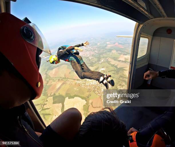 skydiver jump out the plane - diving to the ground bildbanksfoton och bilder