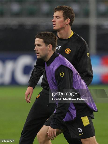 Oliver Gill and Michael Owen of Manchester United in action during a first team training session ahead of their UEFA Champions League match against...