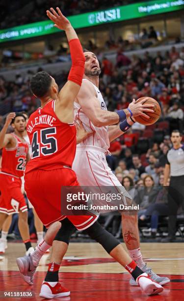 Marcin Gortat of the Washington Wizards moves against Denzel Valentine of the Chicago Bulls at the United Center on April 1, 2018 in Chicago,...