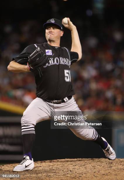 Relief pitcher Jake McGee of the Colorado Rockies pitches against the Arizona Diamondbacks during the MLB game at Chase Field on March 30, 2018 in...